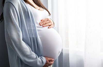 pregnant woman at window