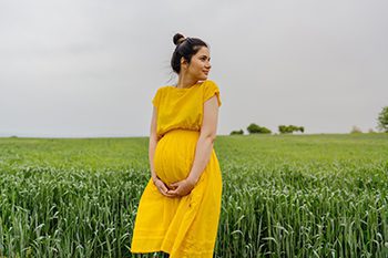 pregnant woman in field